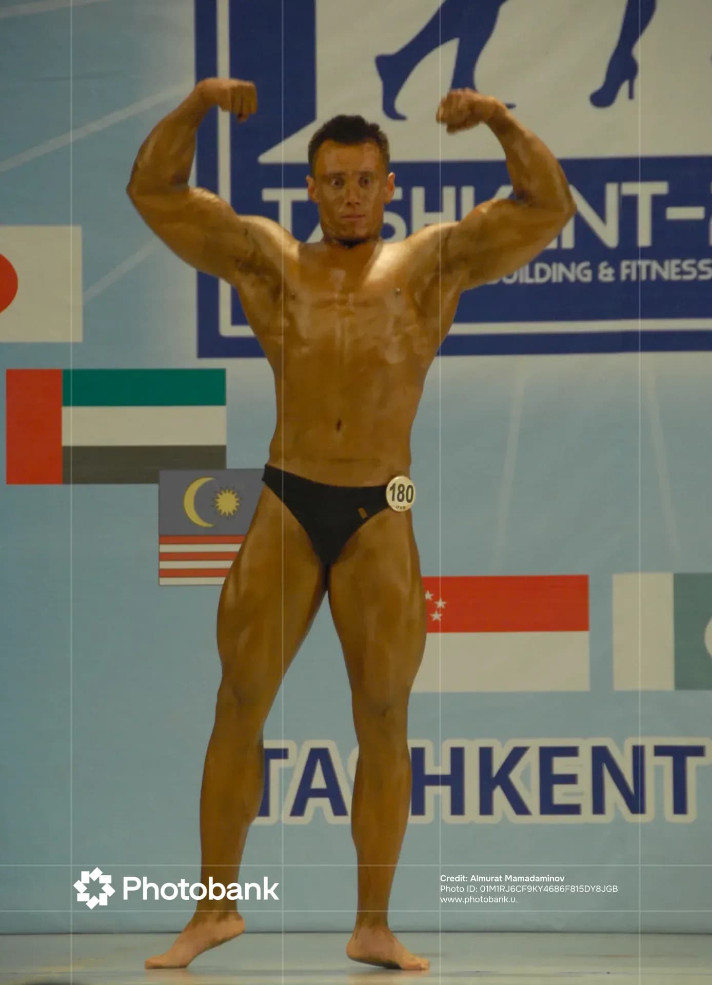 Bodybuilder posing during a sports competition