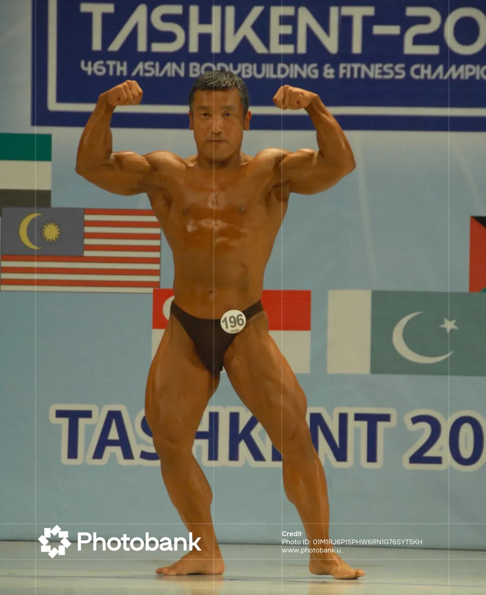 Bodybuilder posing during a sports competition