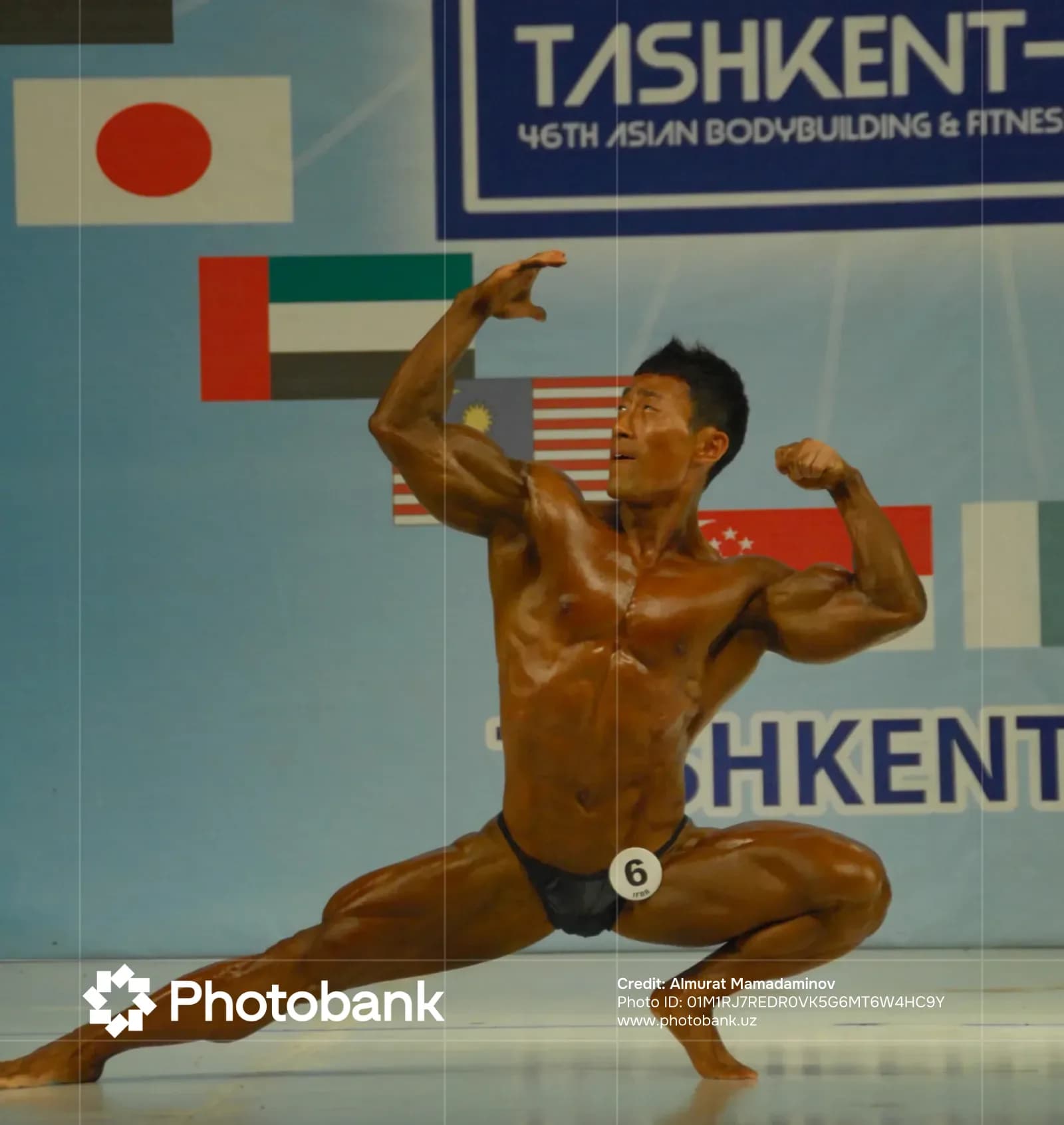 Bodybuilder posing during a sports competition