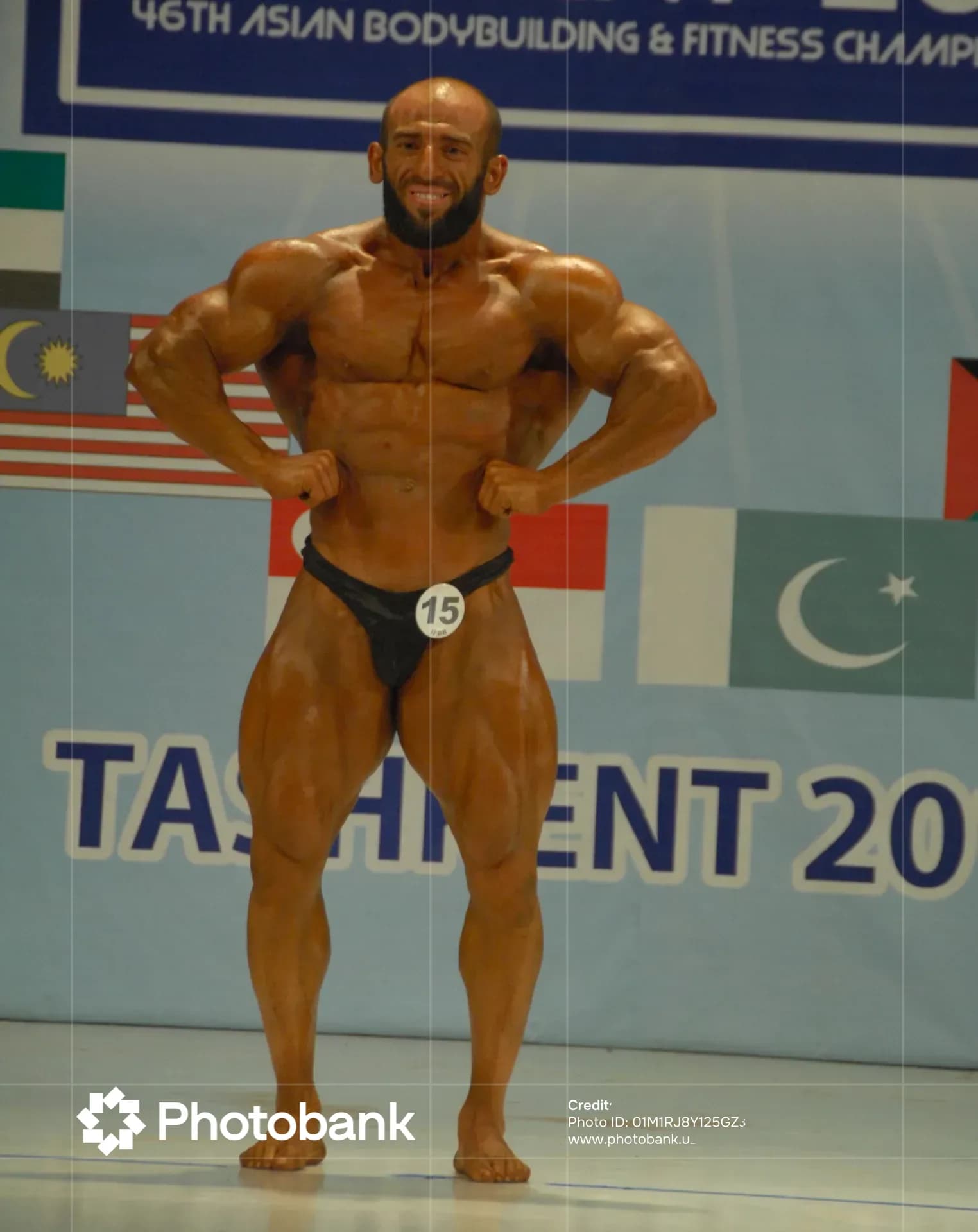 Bodybuilder posing during a sports competition