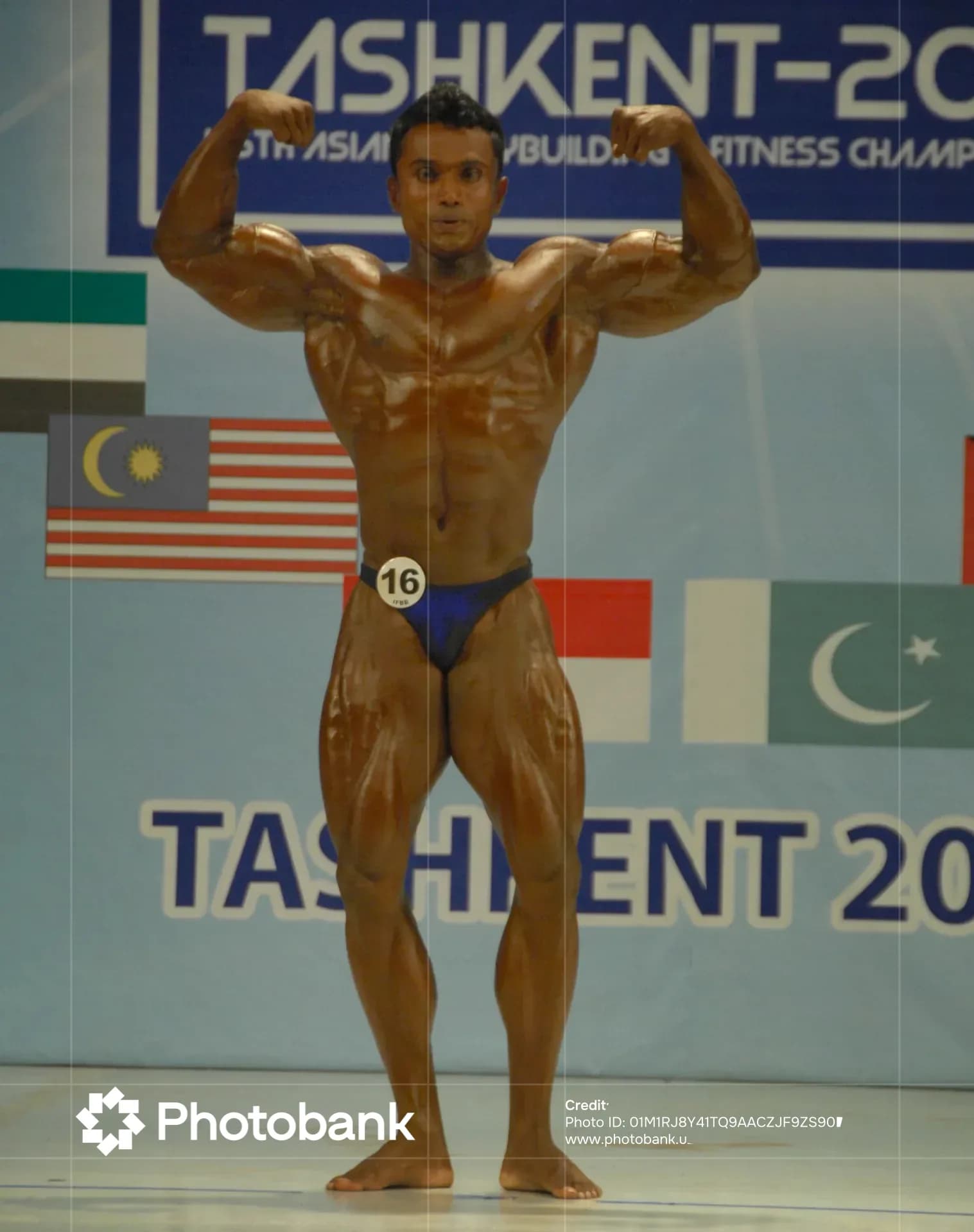 Bodybuilder posing during a sports competition