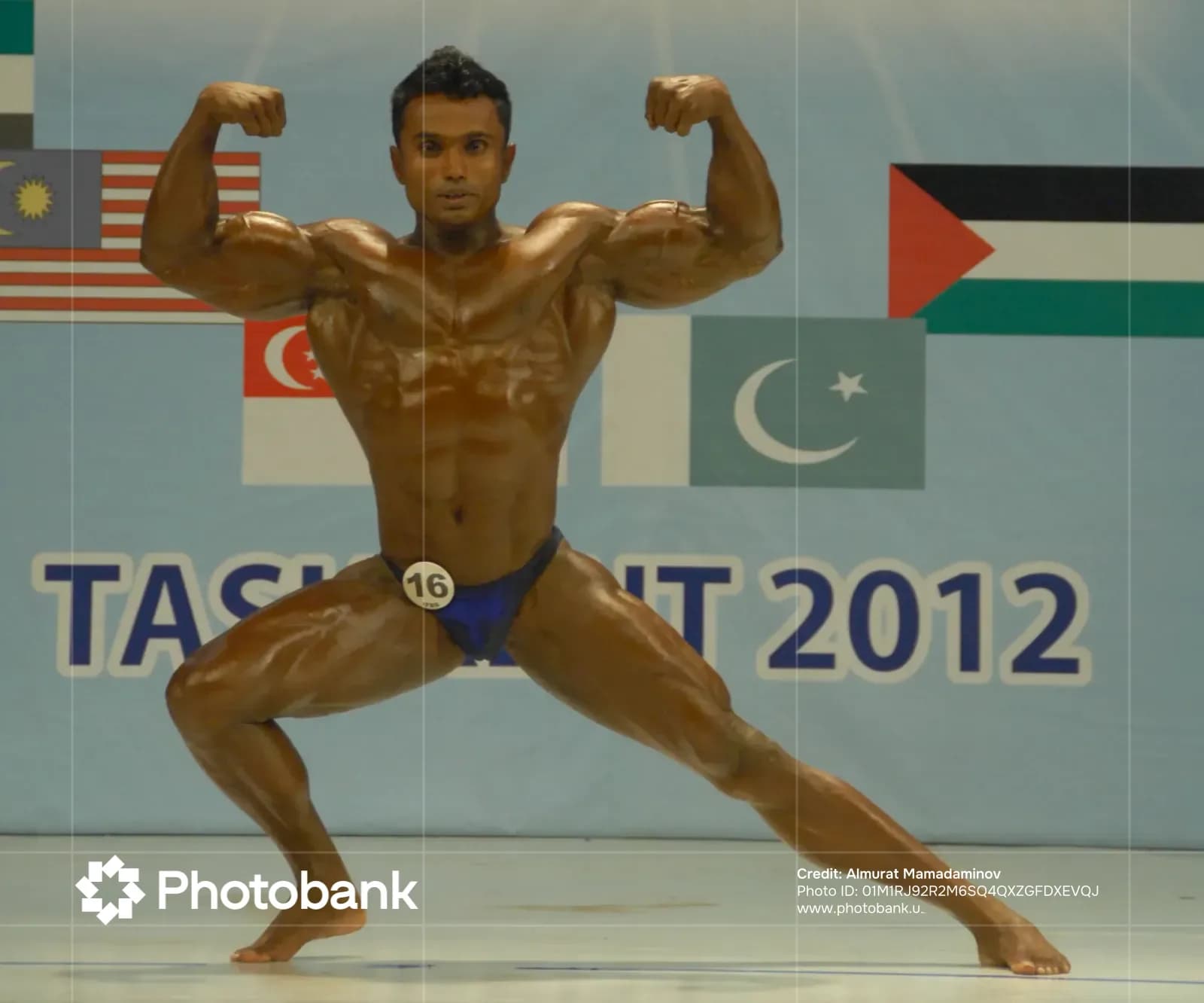 Bodybuilder posing during a sports competition