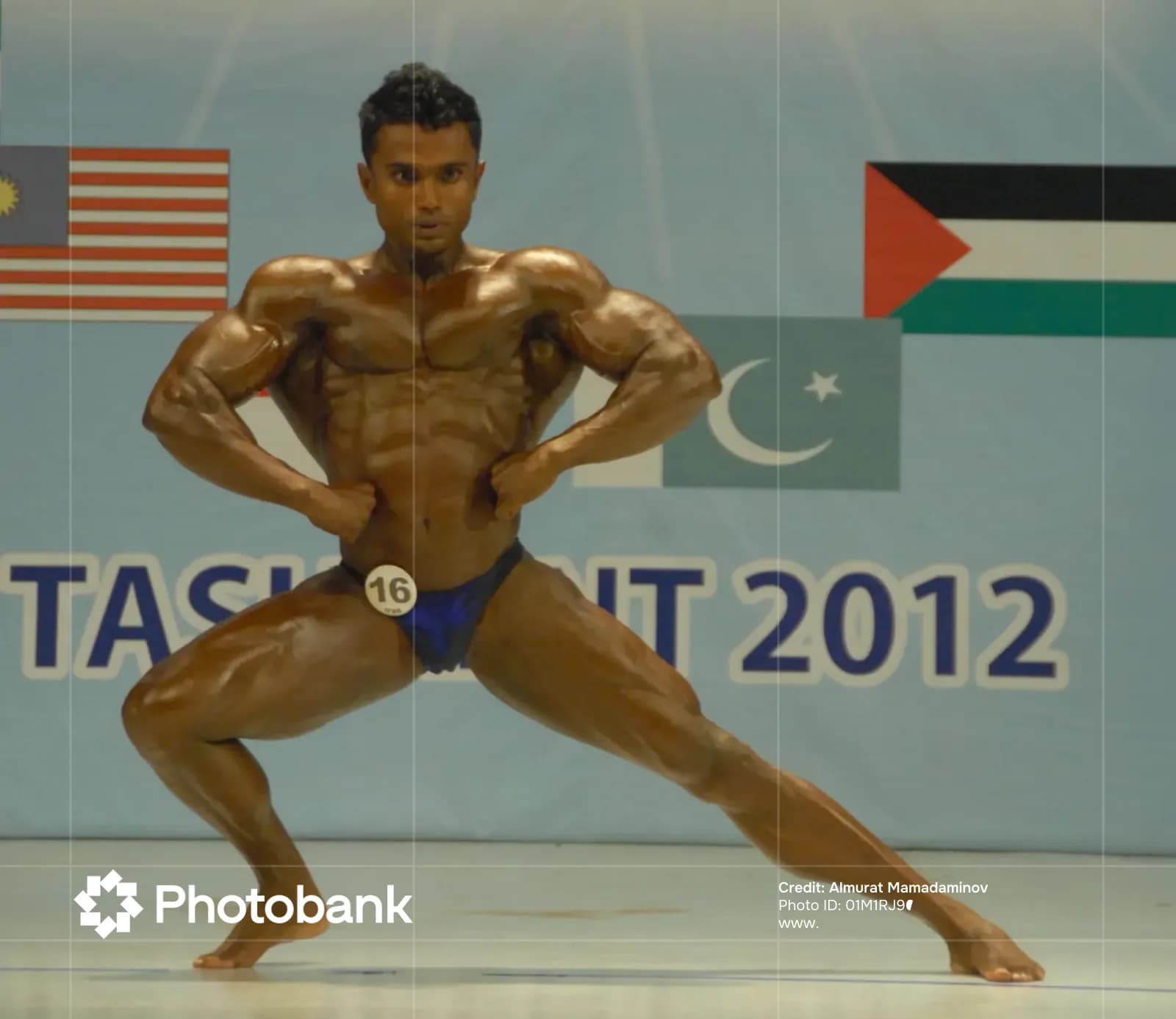 Athlete performing a bodybuilding pose on stage