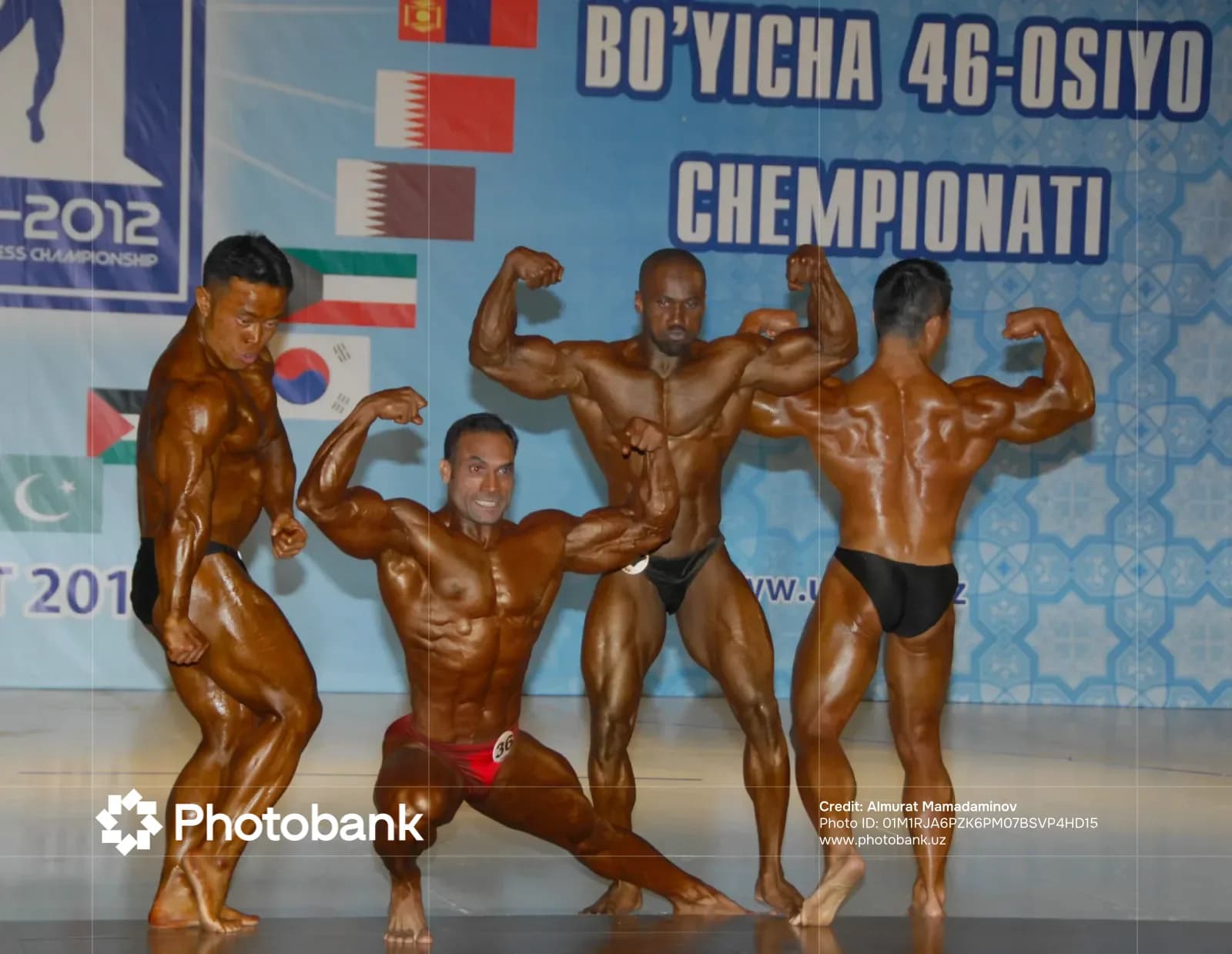 Bodybuilders posing on stage during a competition