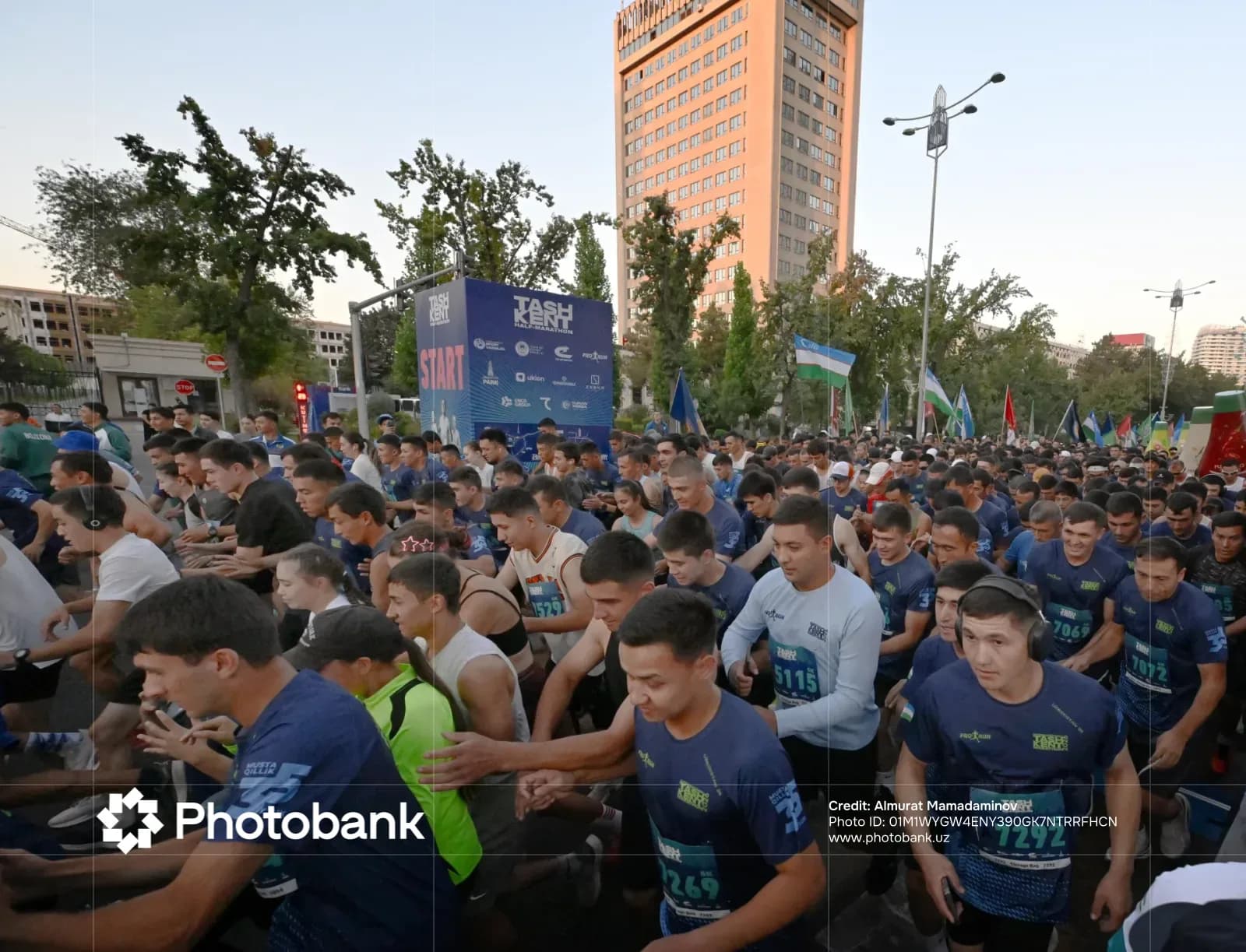 Crowd of runners participating in a street running competition in a city