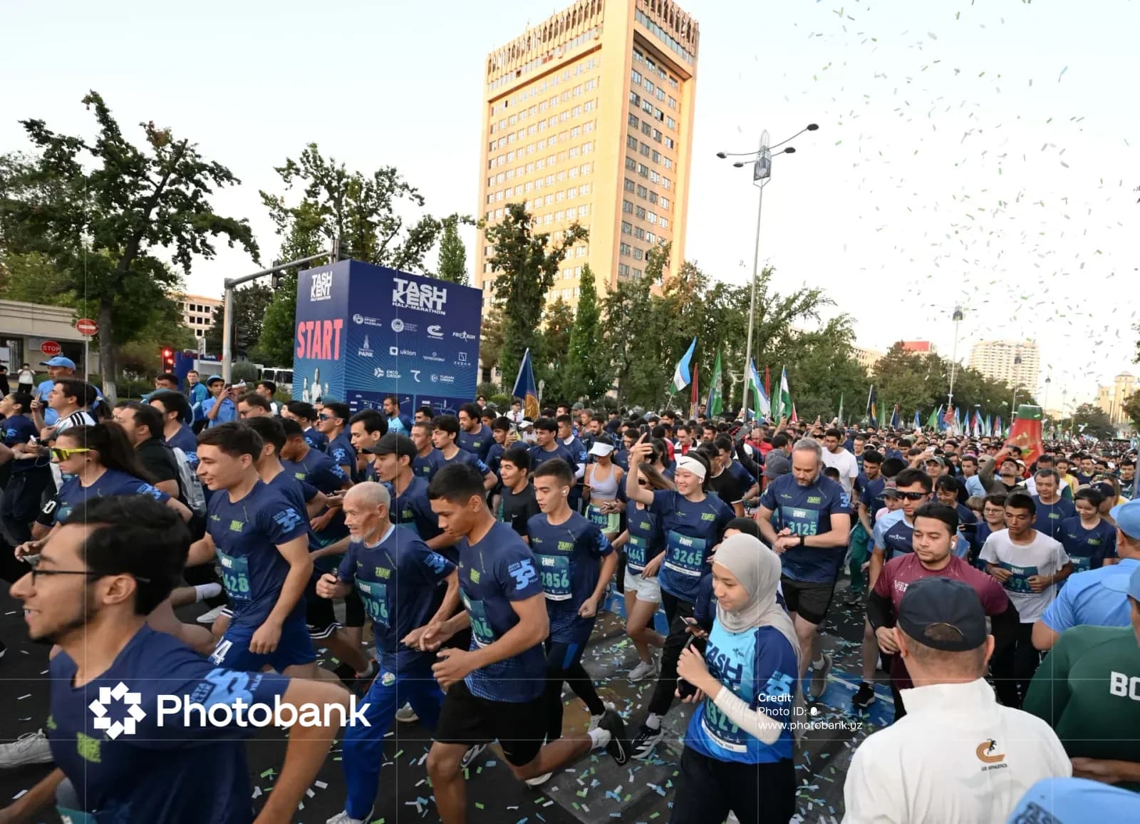 Large crowd of runners participating in a street race event in Tashkent