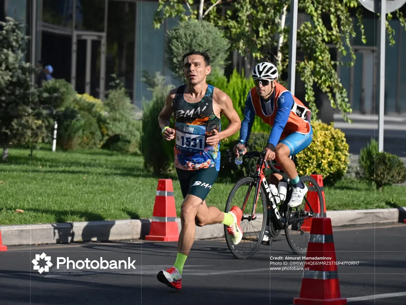 Athlete running along a city street during a competition
