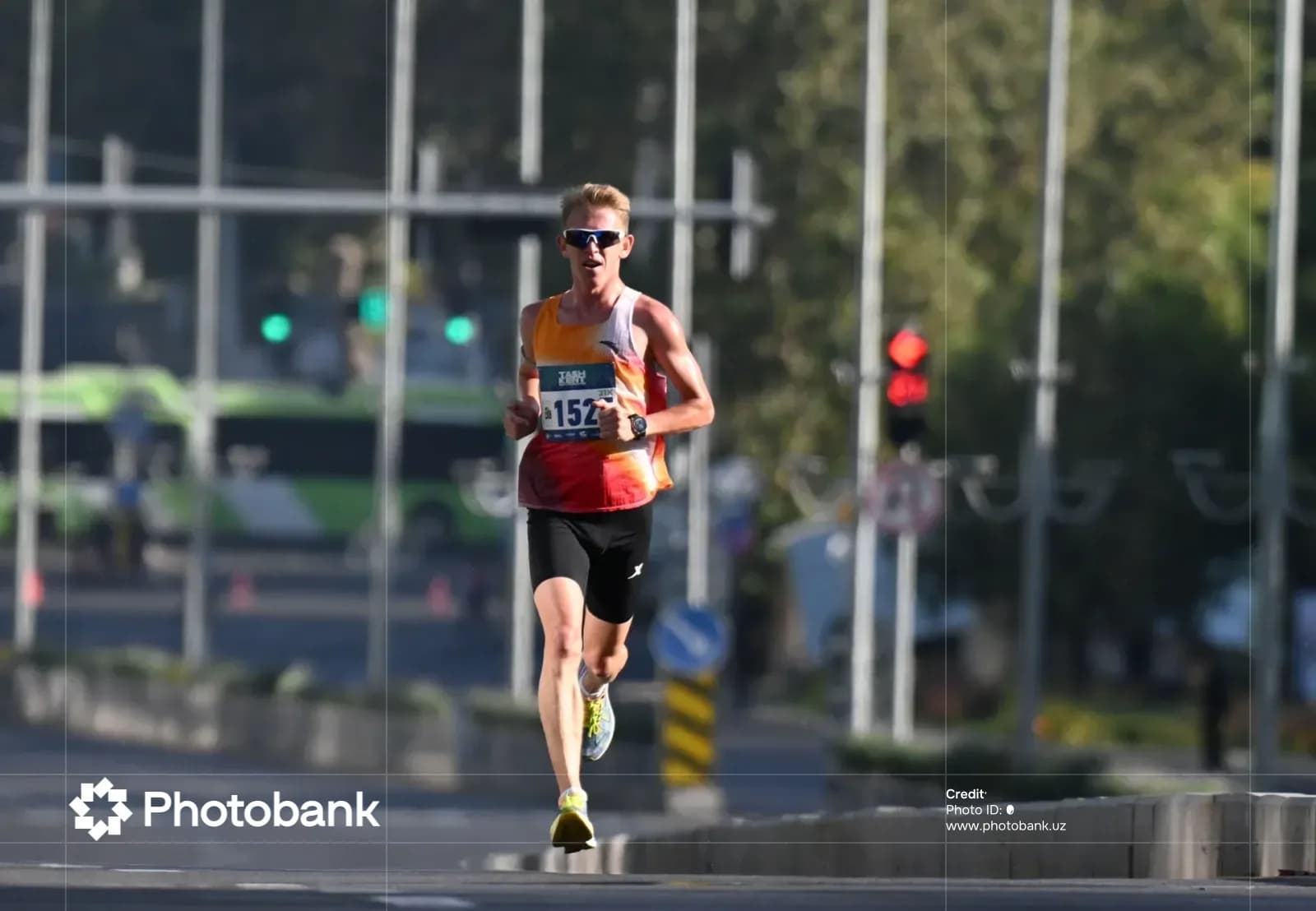 Athlete running along a city street during a competition