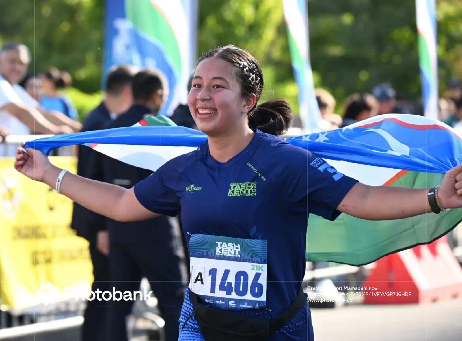 Smiling participant holding flag during running event