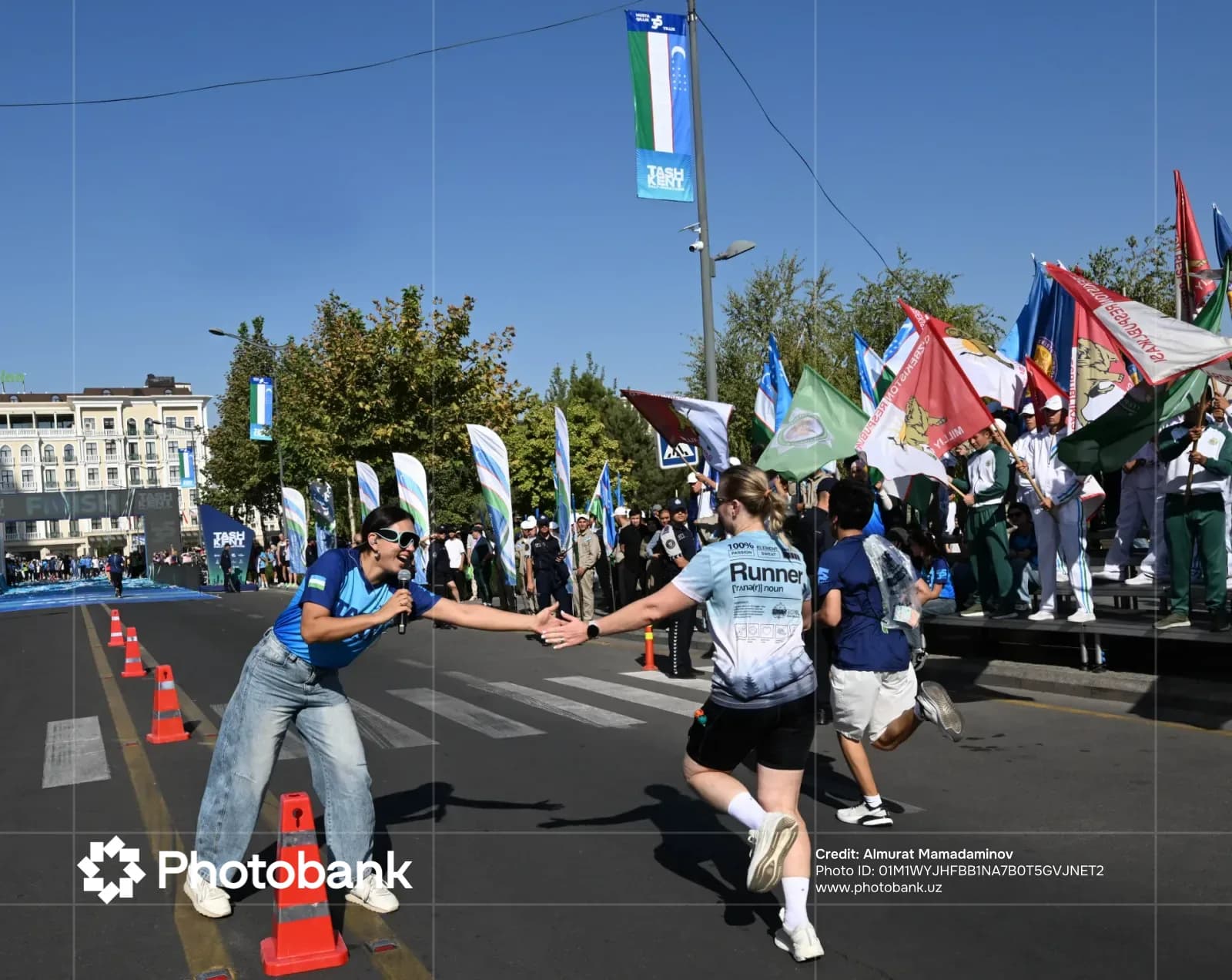 People running on a city street during a sport event