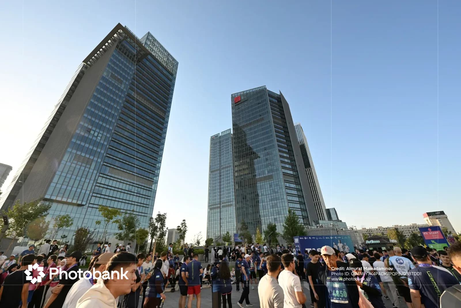 People gathered in front of modern skyscrapers