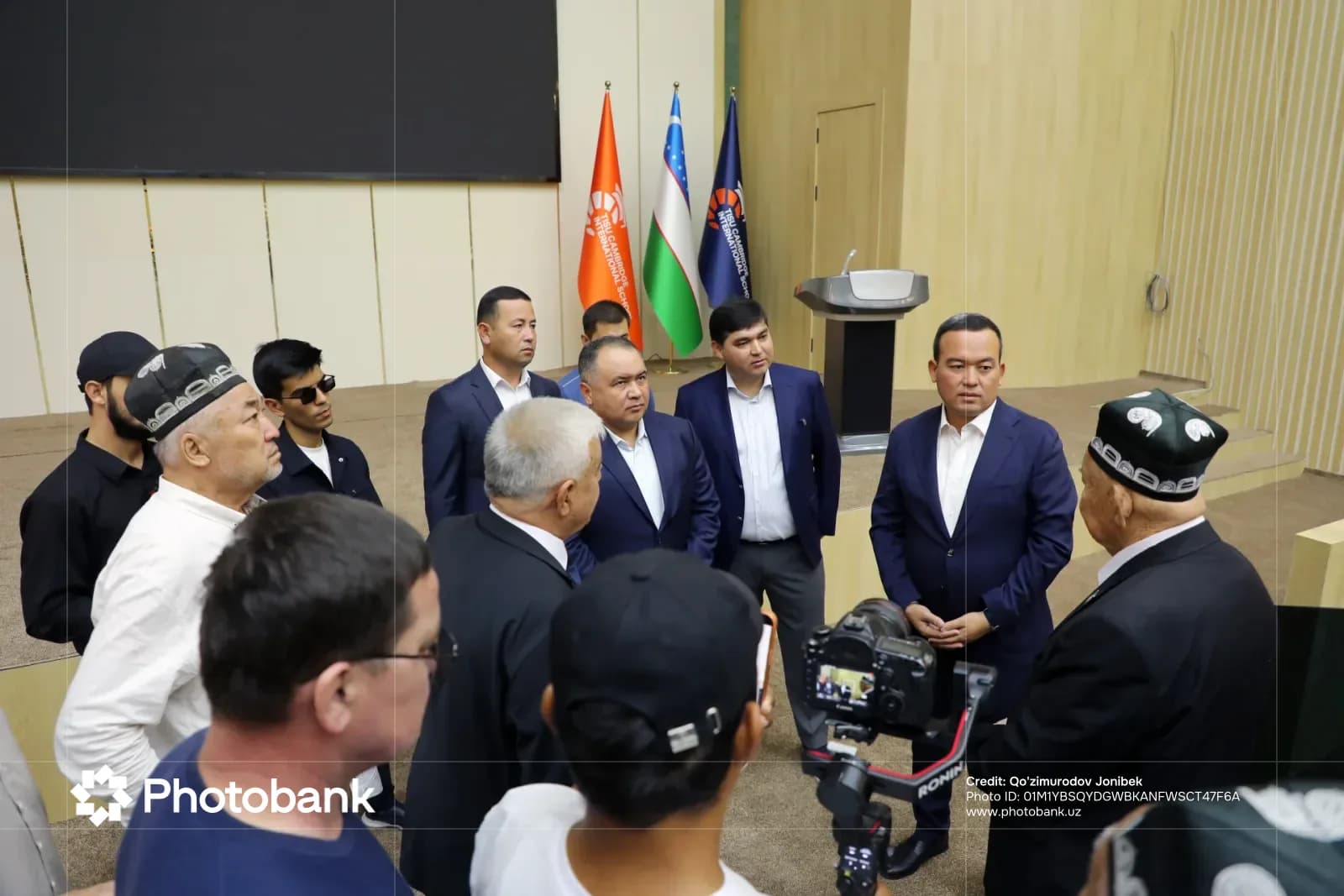 Group of people gathered indoors in a conference hall