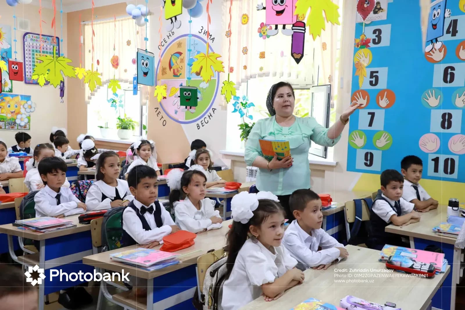Teacher leading a lesson in a classroom with children