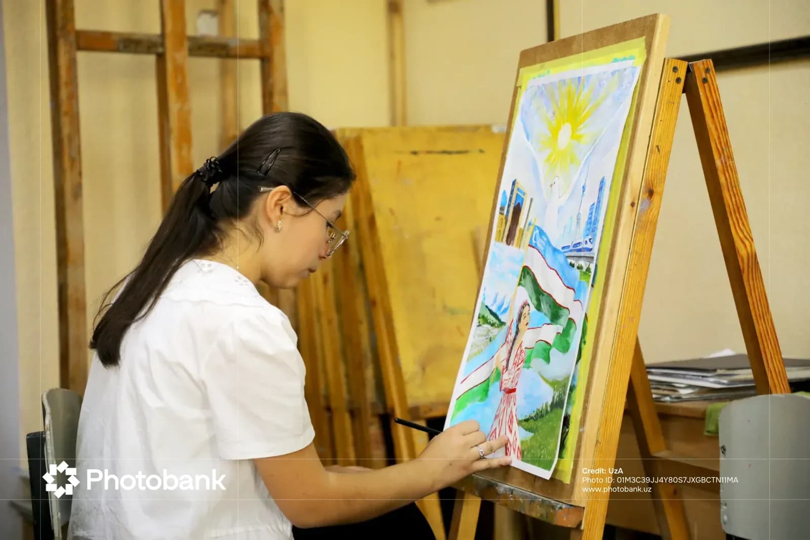 Person painting on an easel