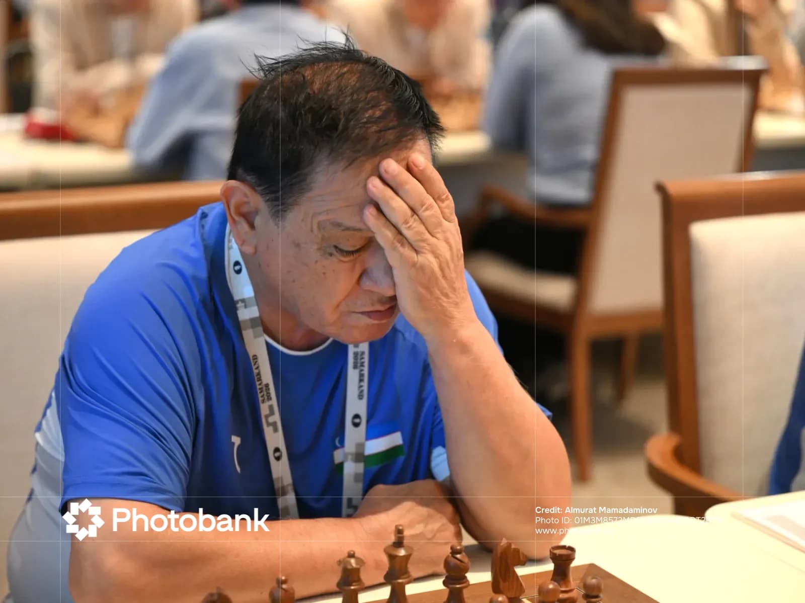 Person playing chess at a table