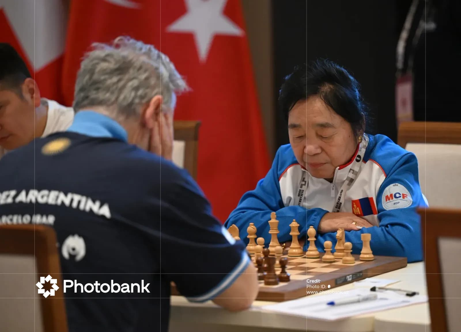People playing a chess match at a table
