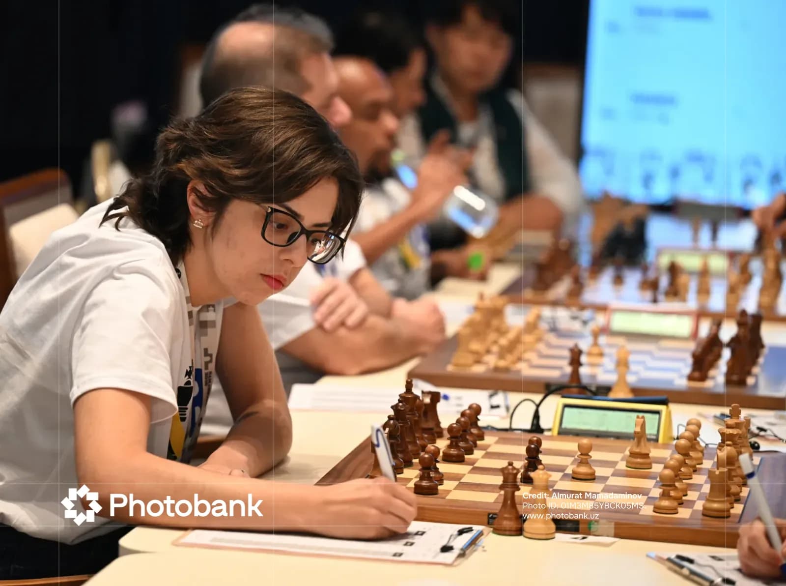 People playing chess at tables
