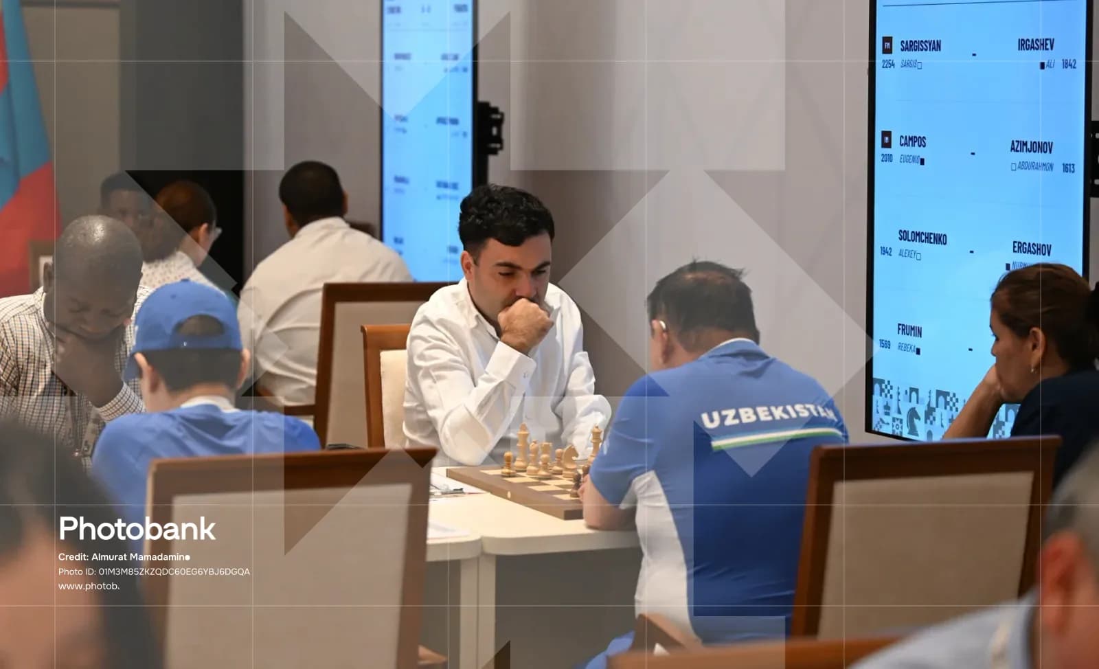 People playing chess at tables during a competition