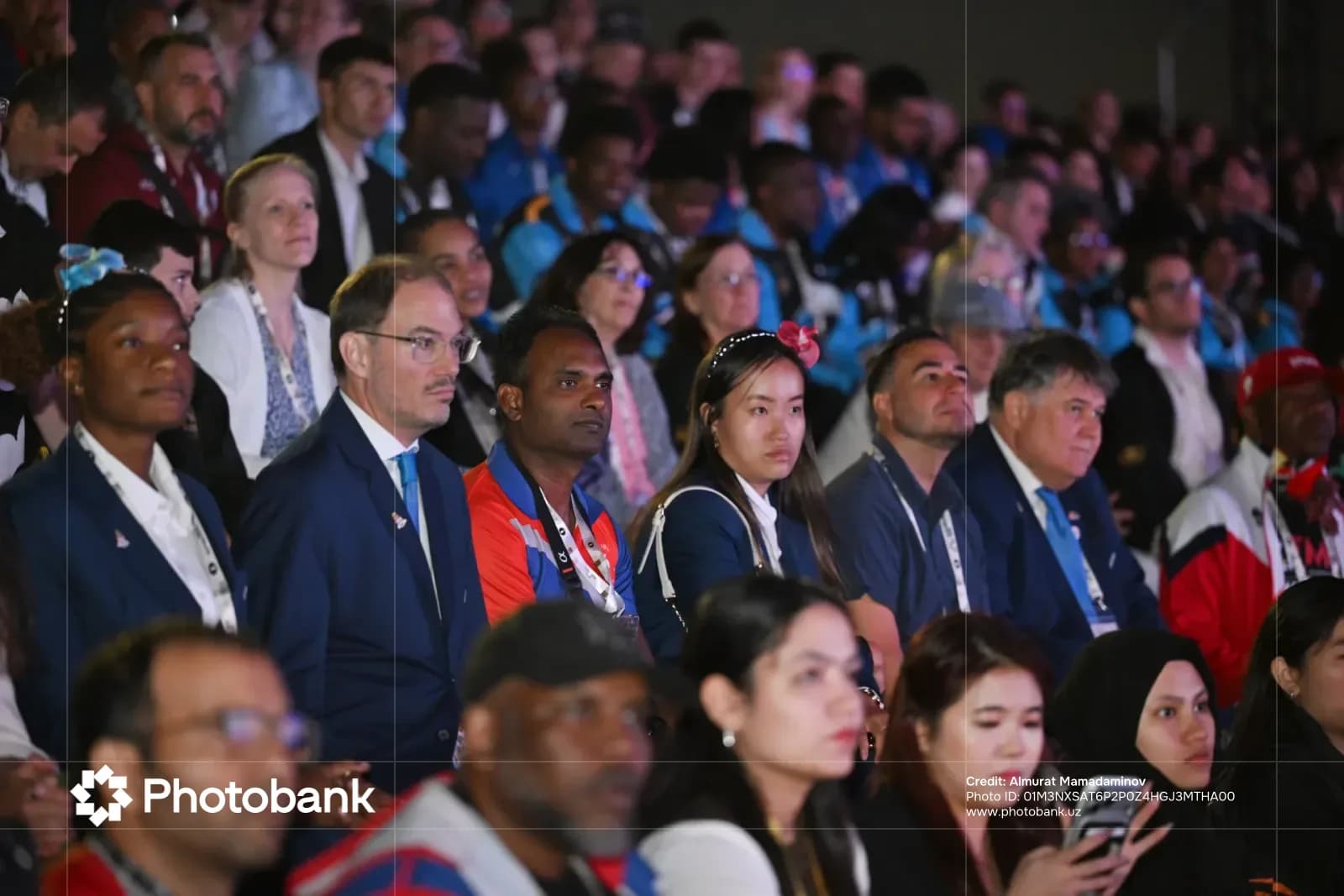 Diverse crowd of people seated in an audience
