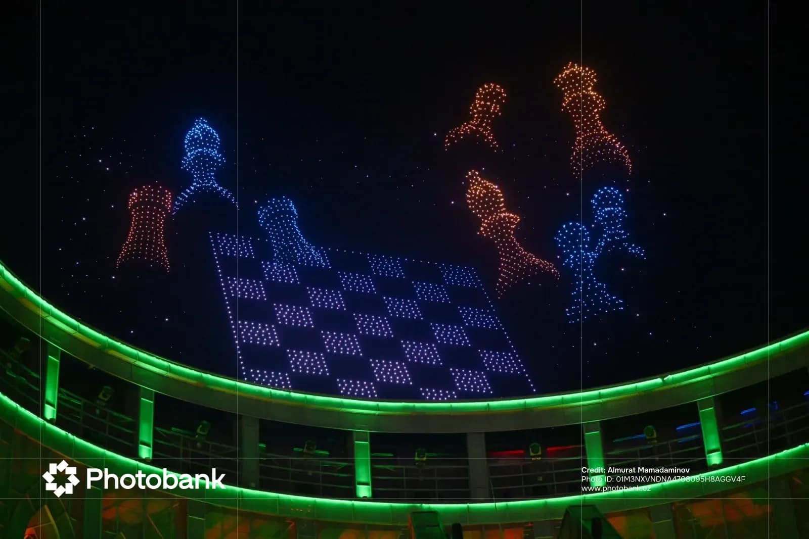Light display forming chess pieces in the night sky