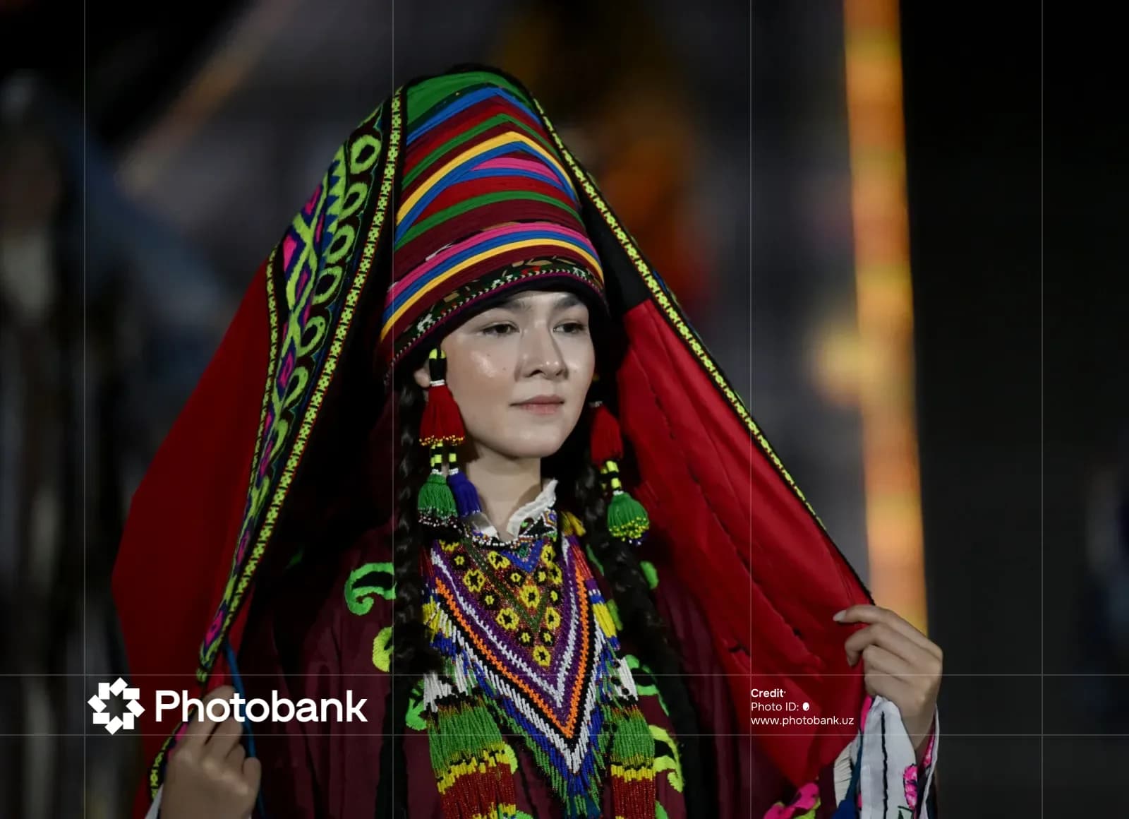 Person wearing traditional clothing and ornate headwear