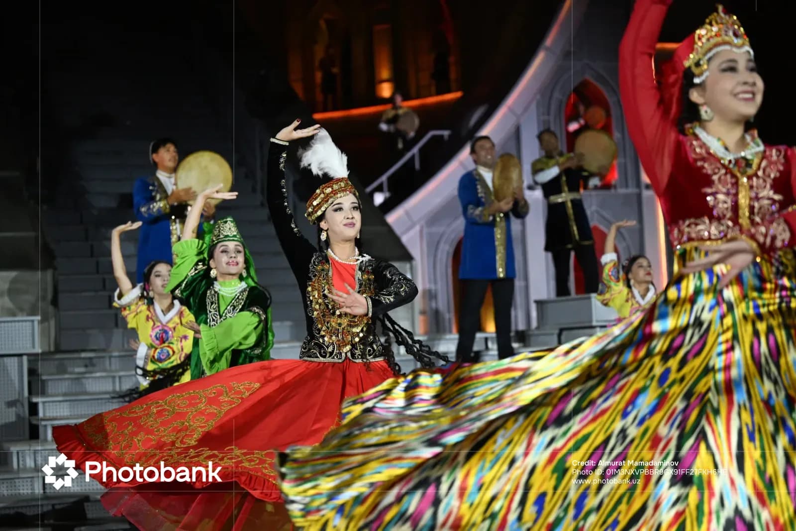 Performers in traditional clothing dancing on stage