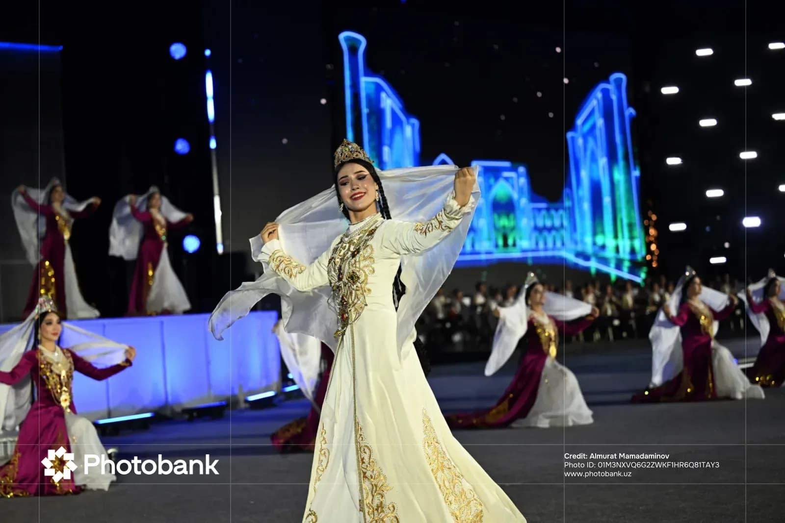 Performers in traditional clothing dancing on stage