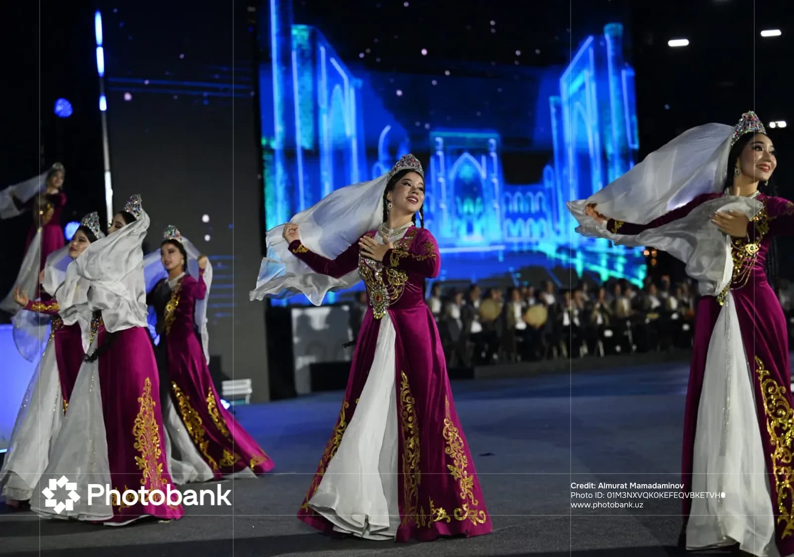 Performers in traditional clothing dancing on stage