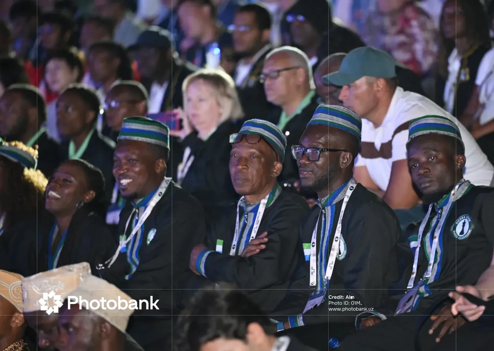 People seated in an audience at a public gathering