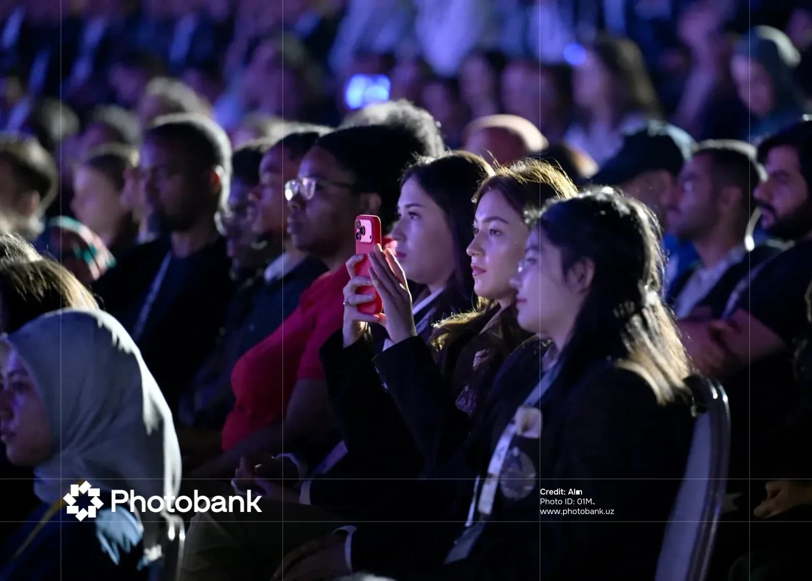 People in an audience watching an event