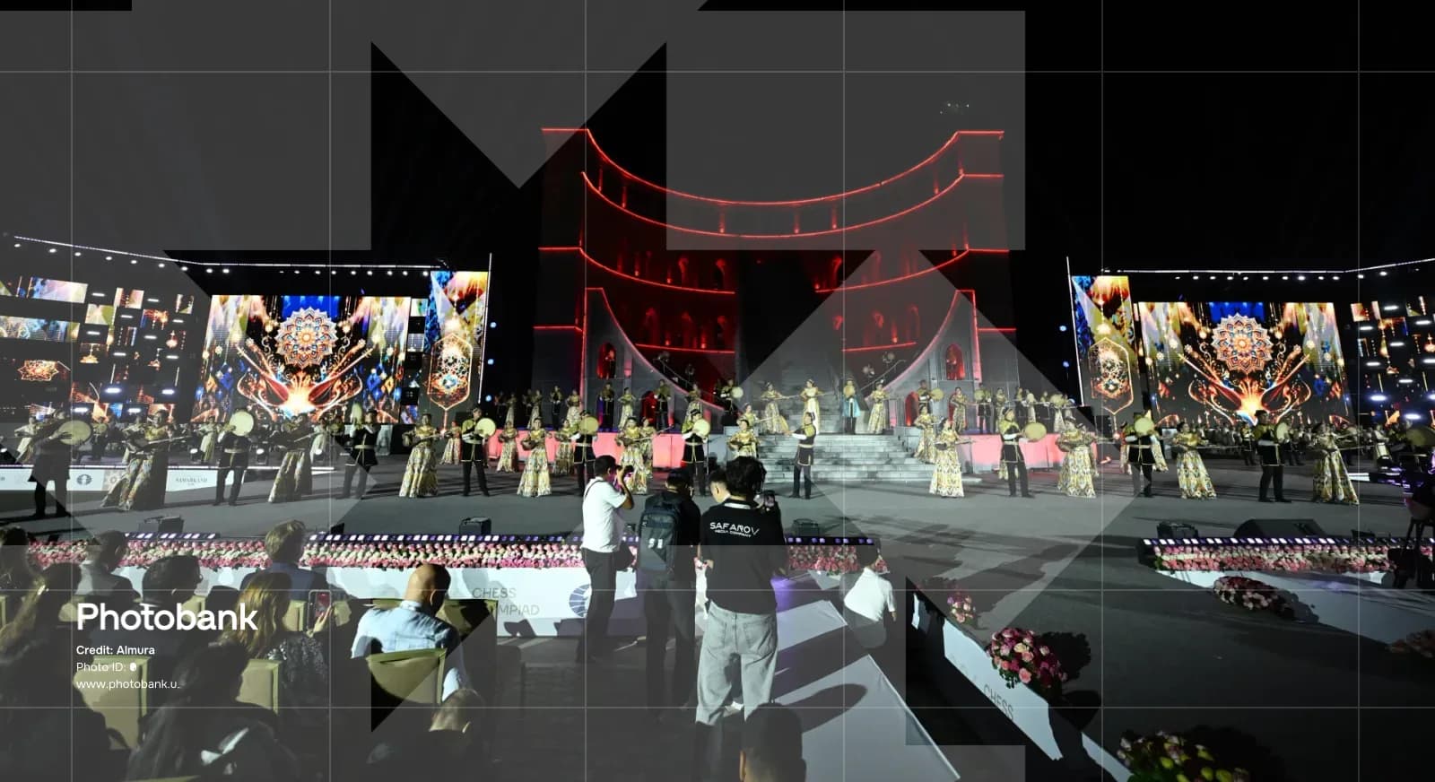 Performers on stage during an evening event