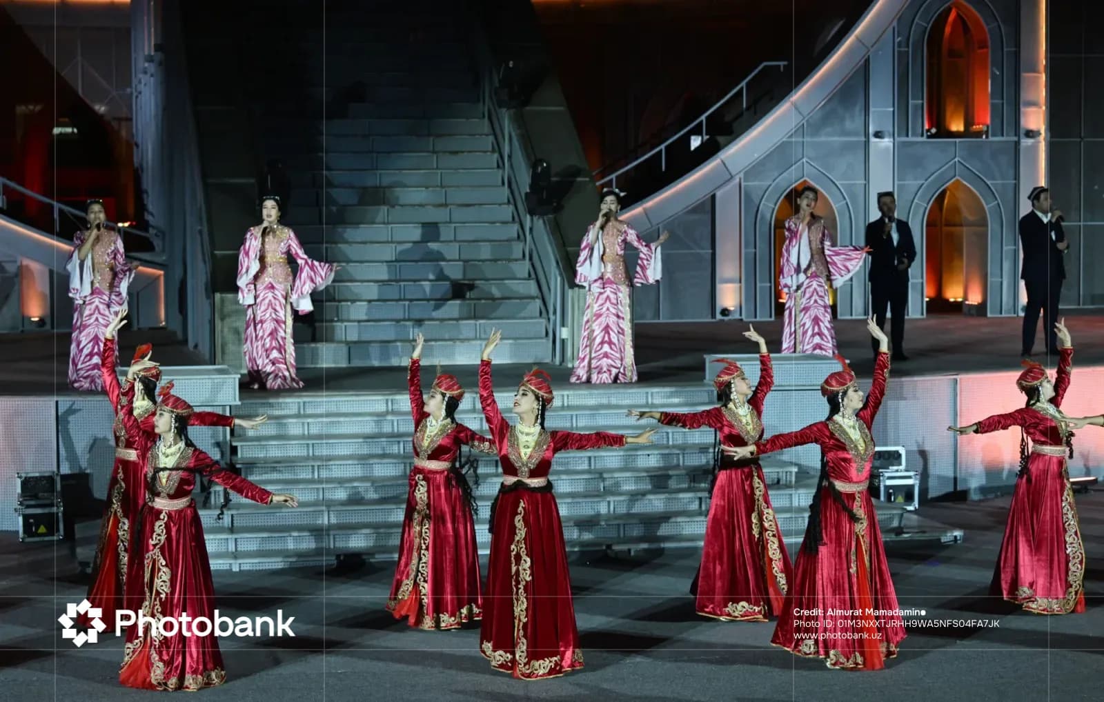 Performers in traditional clothing on an outdoor stage