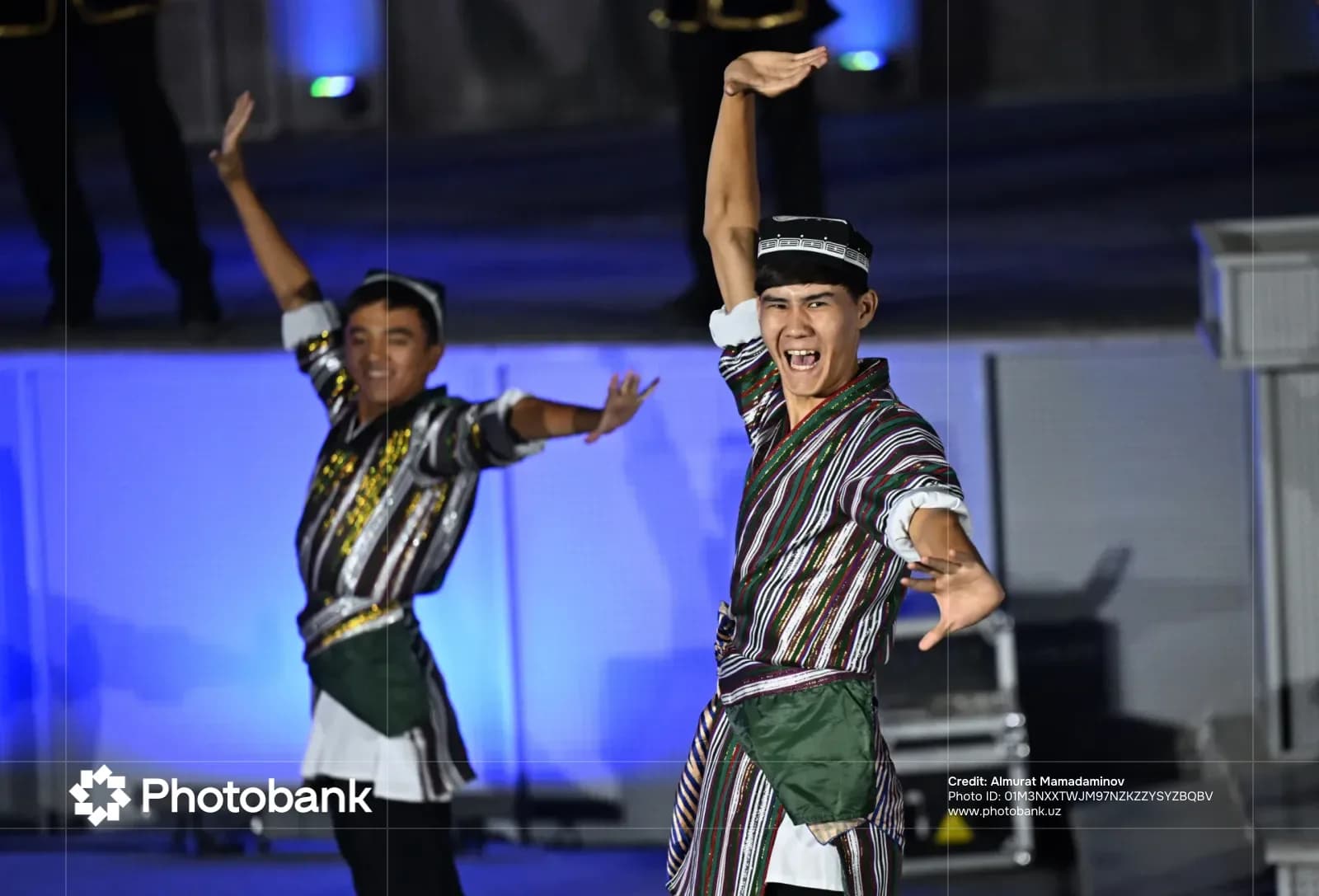 Performers in traditional clothing dancing on stage