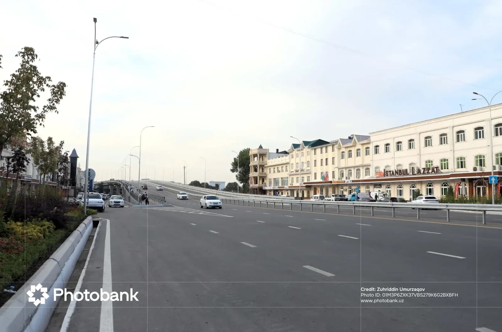 Vehicles driving on an asphalt road in a city