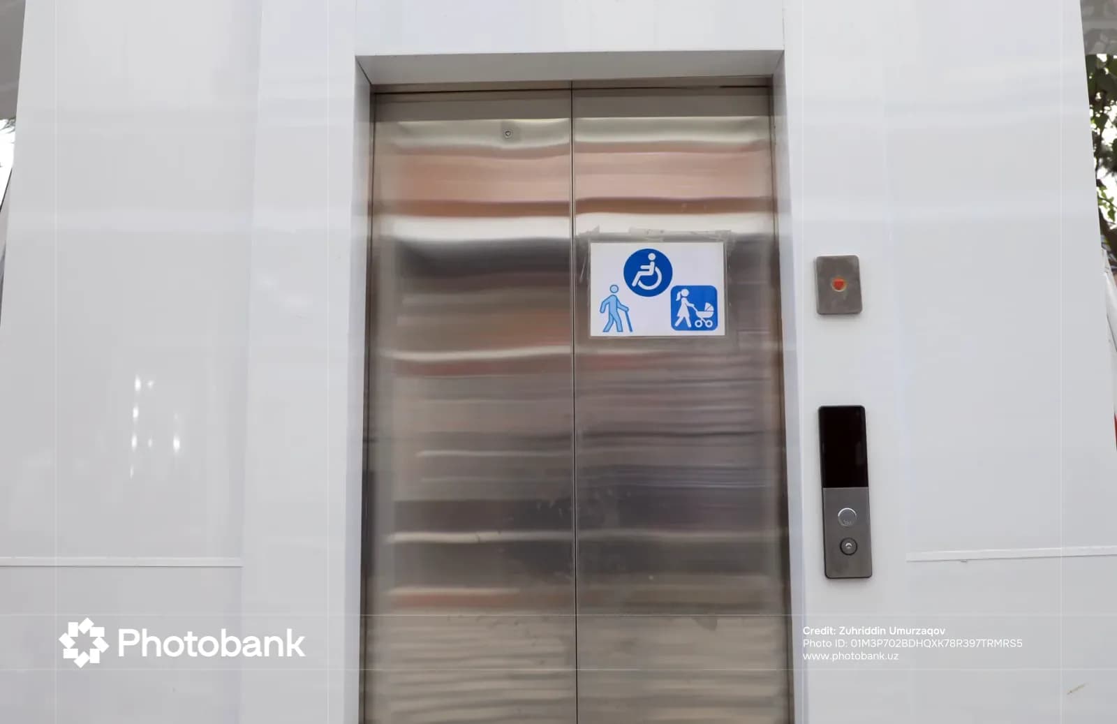 Modern elevator doors with accessibility signs