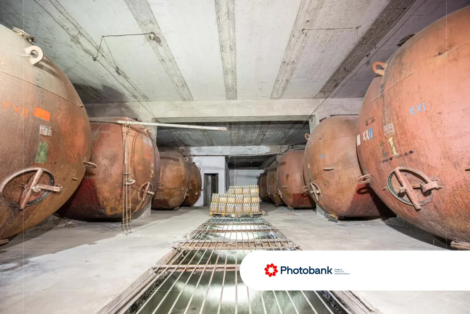 Industrial room with large metal tanks