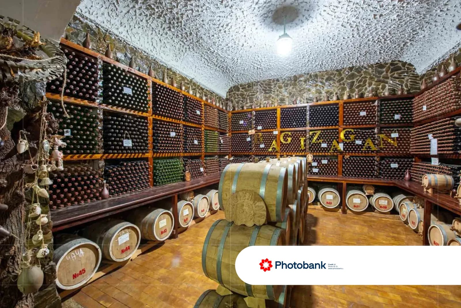Wine cellar interior with wooden shelves and barrels