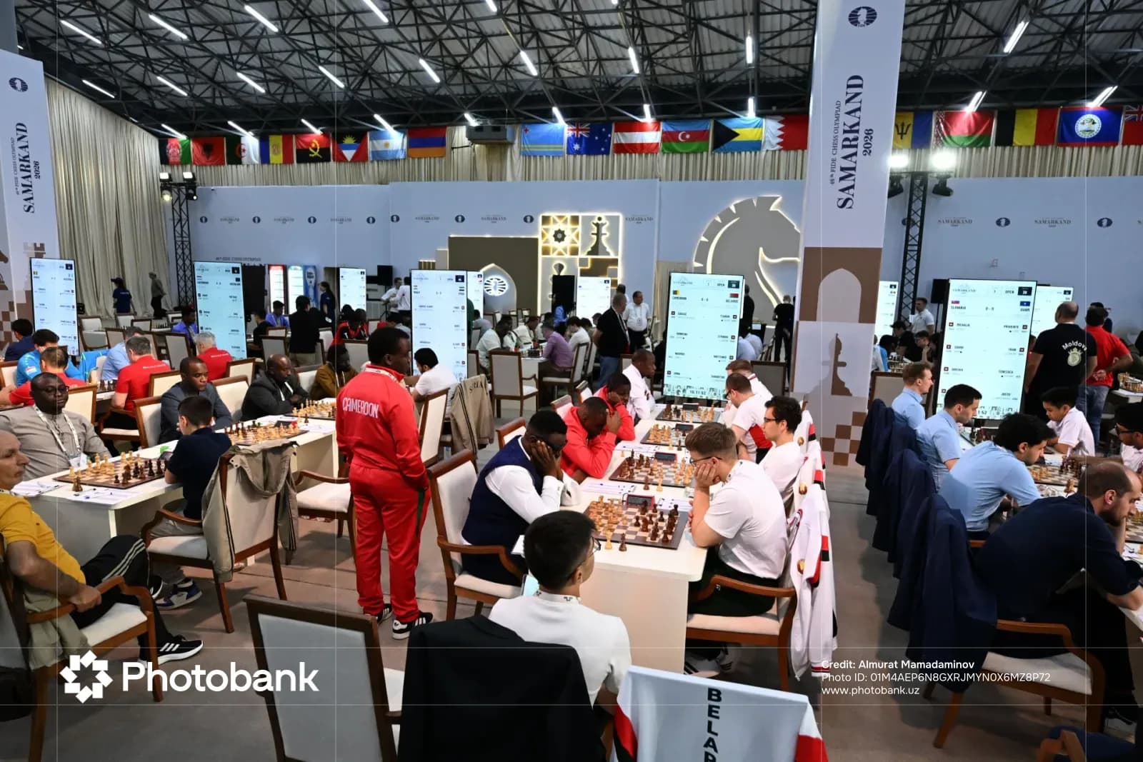 People playing chess at a large competition hall