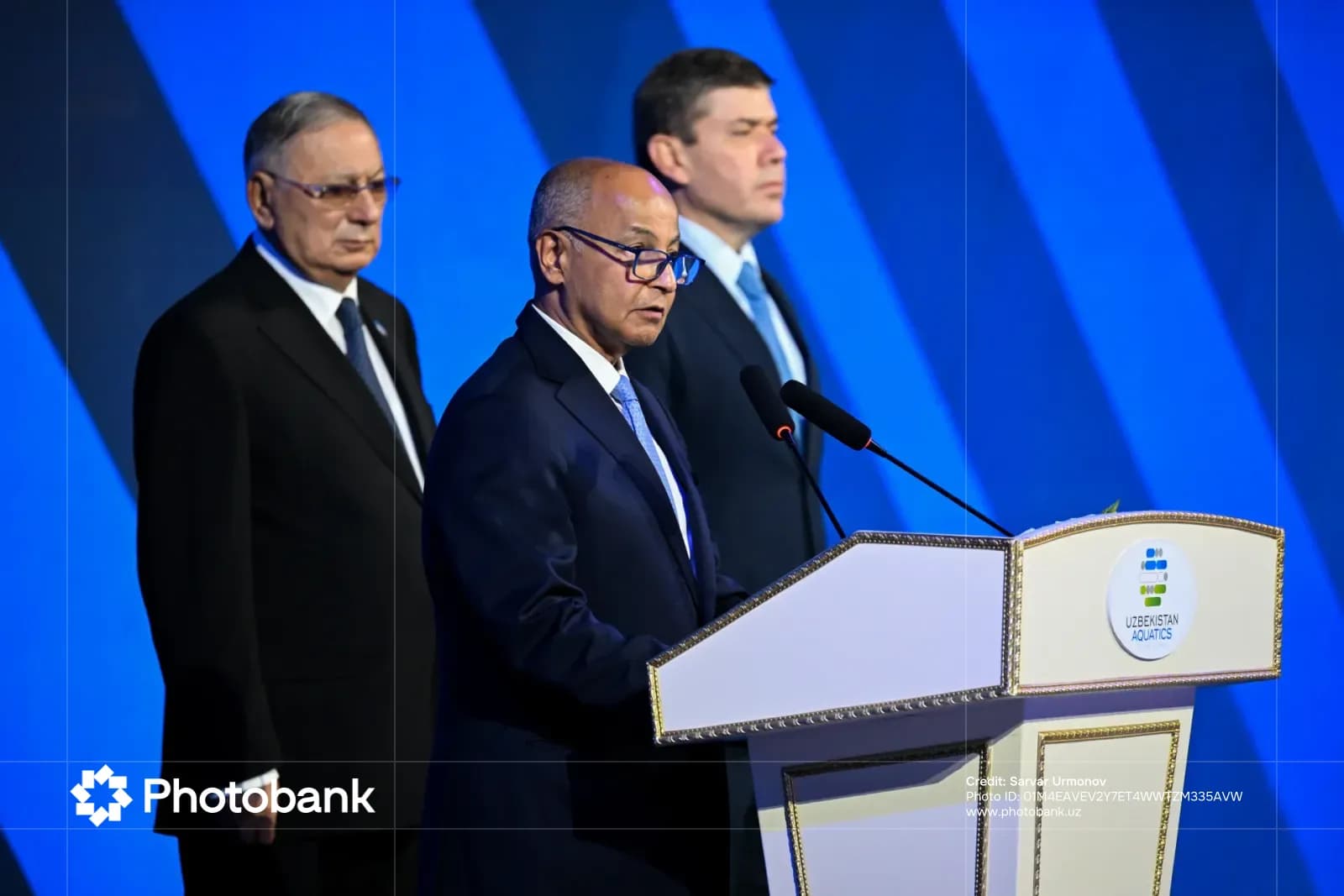 Odil Abdurahmonov speaking at a podium
