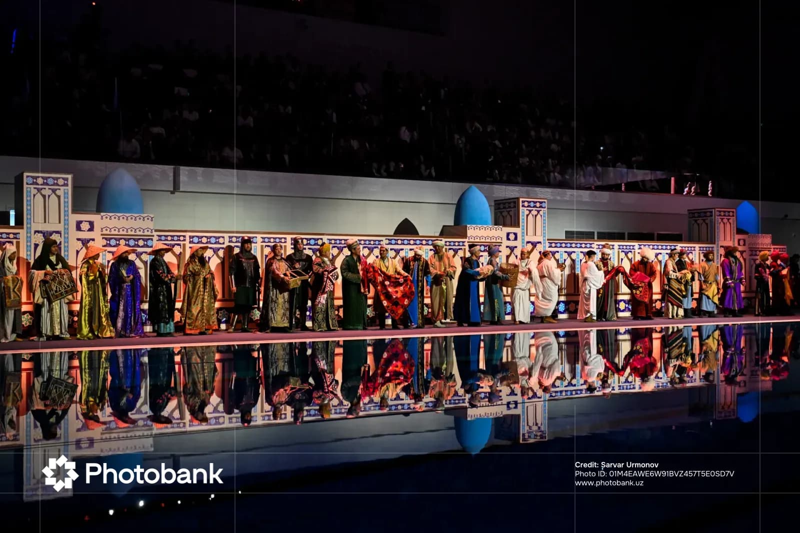Performers in traditional clothing standing on stage