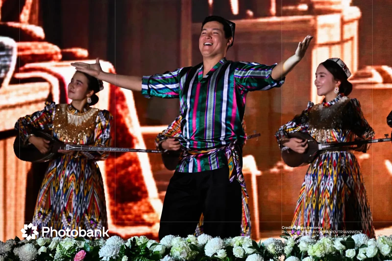 Performers in traditional clothing on stage