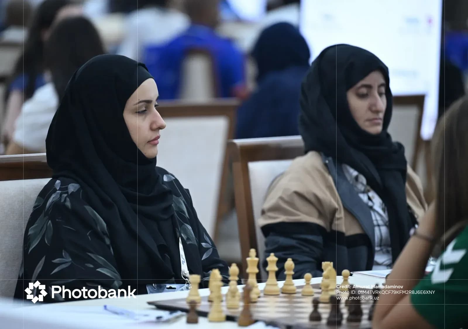 People playing chess indoors