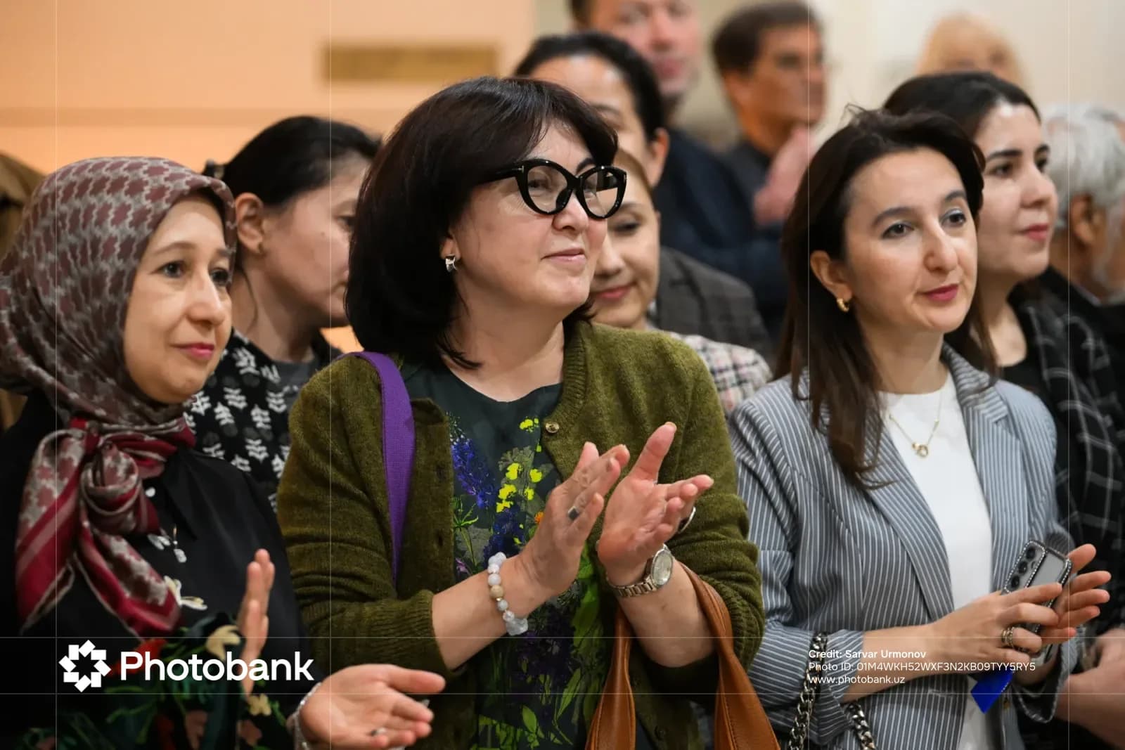 People clapping in a gathering