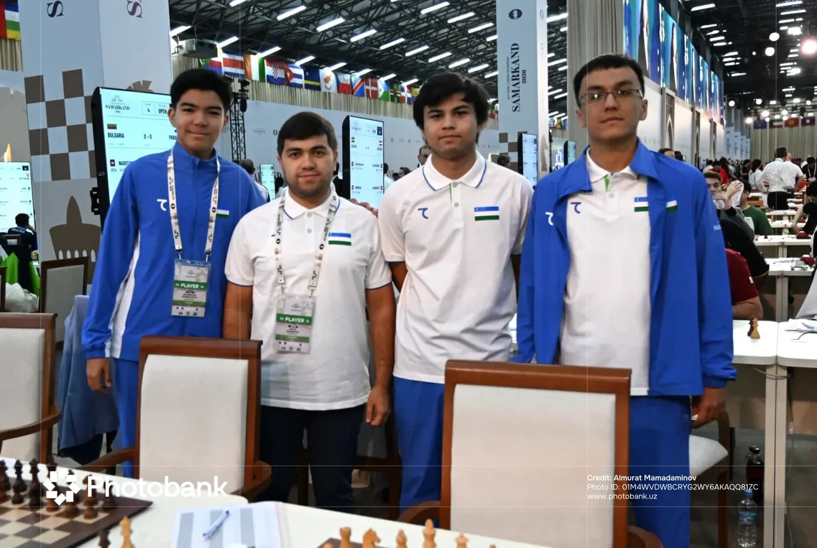 Group photo of athletes standing in a competition hall