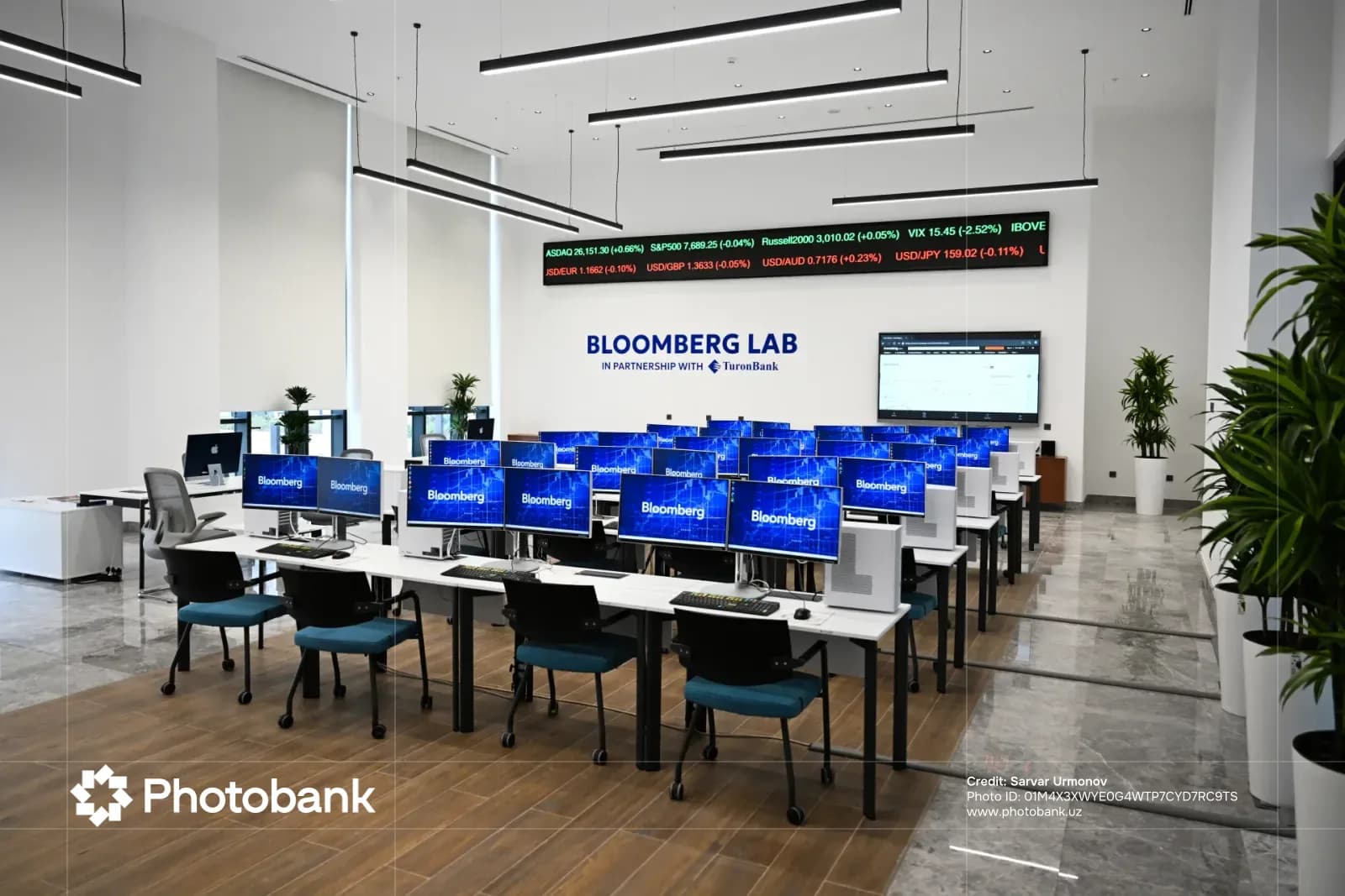 Modern financial workspace with multiple computer terminals