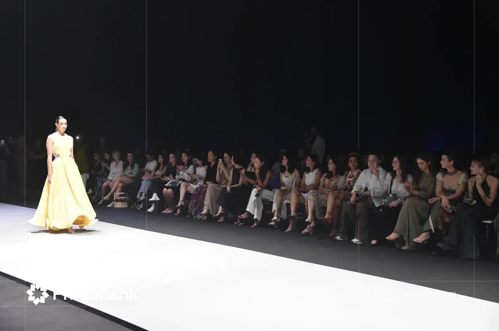 Model walking on runway during fashion show