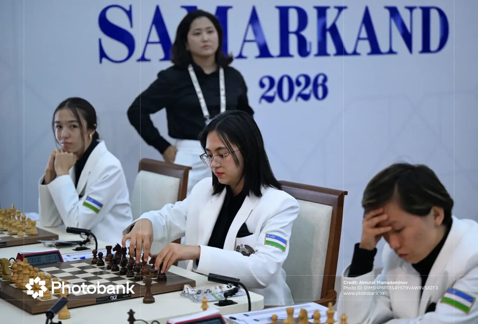 Players competing in an indoor chess tournament