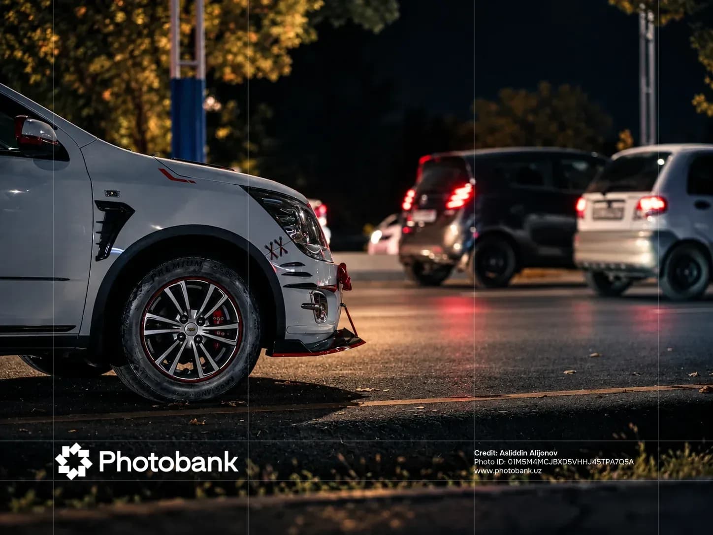 Cars on a city street at night