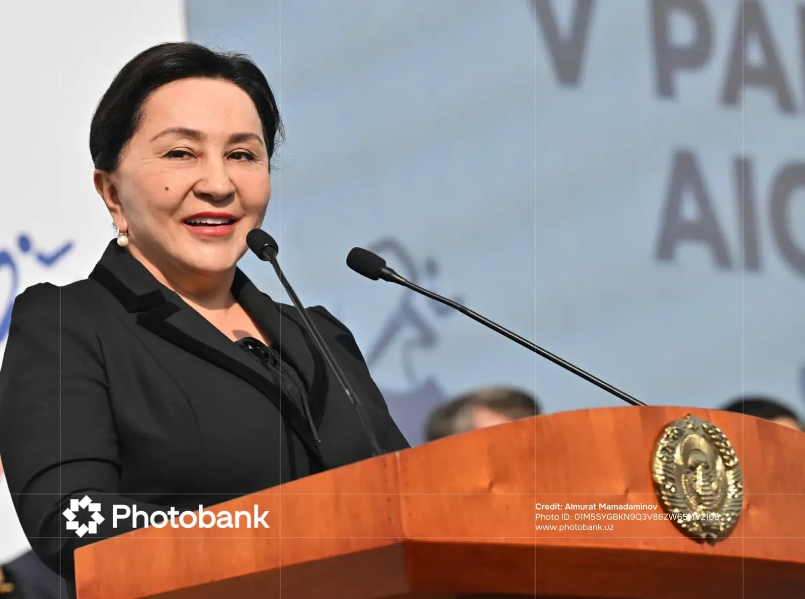Woman speaking behind a podium