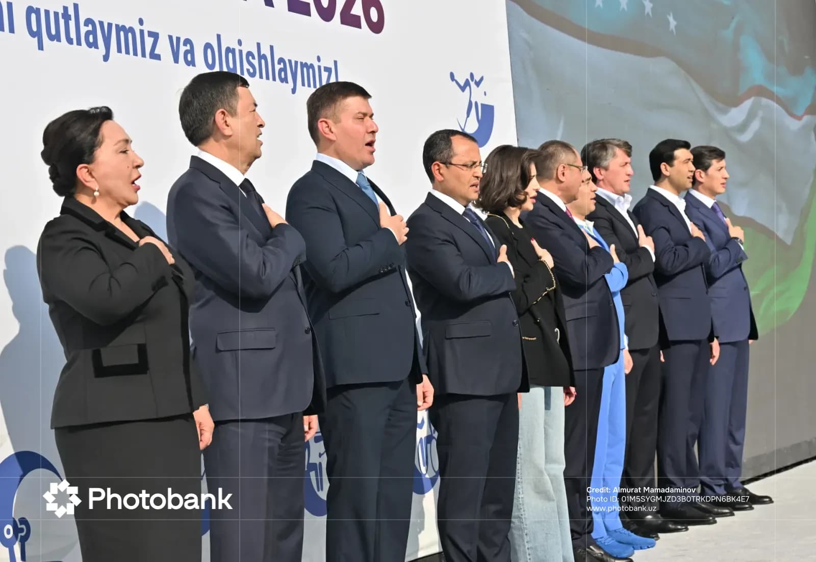 Alisher Saʼdullayev and a group of people standing